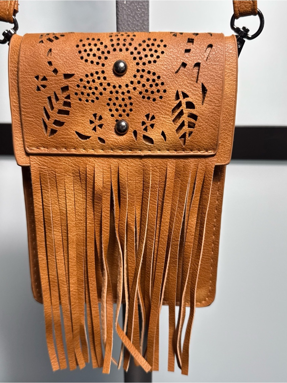 Fringed Tan Crossbody Bag with Laser-Cut Floral Detail